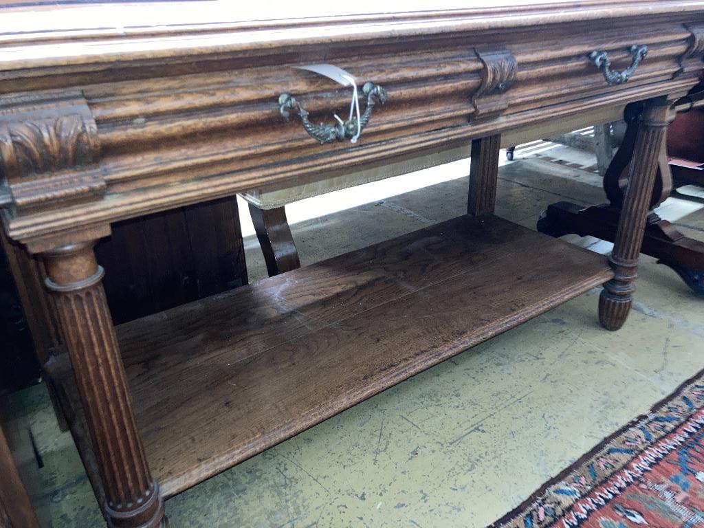 A 19th century French oak two-tier side table, length 130cm, depth 55cm, height 73cm